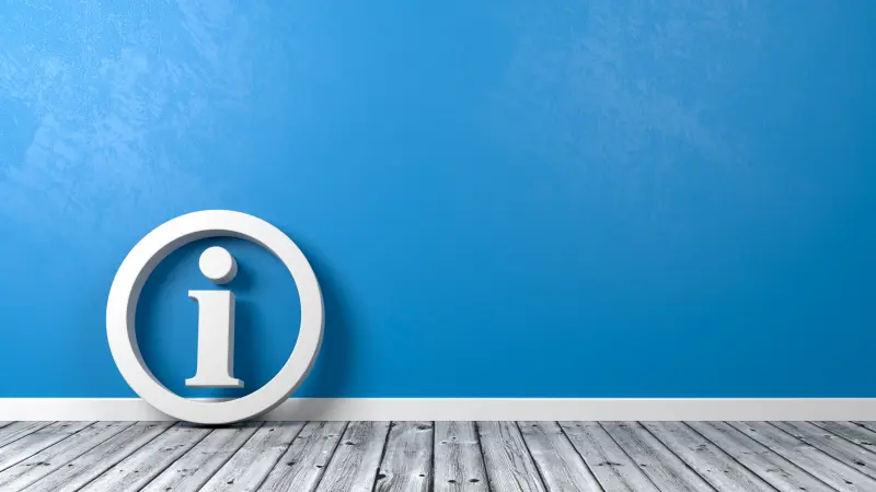Un symbole d’information blanc dans un cercle sur fond bleu